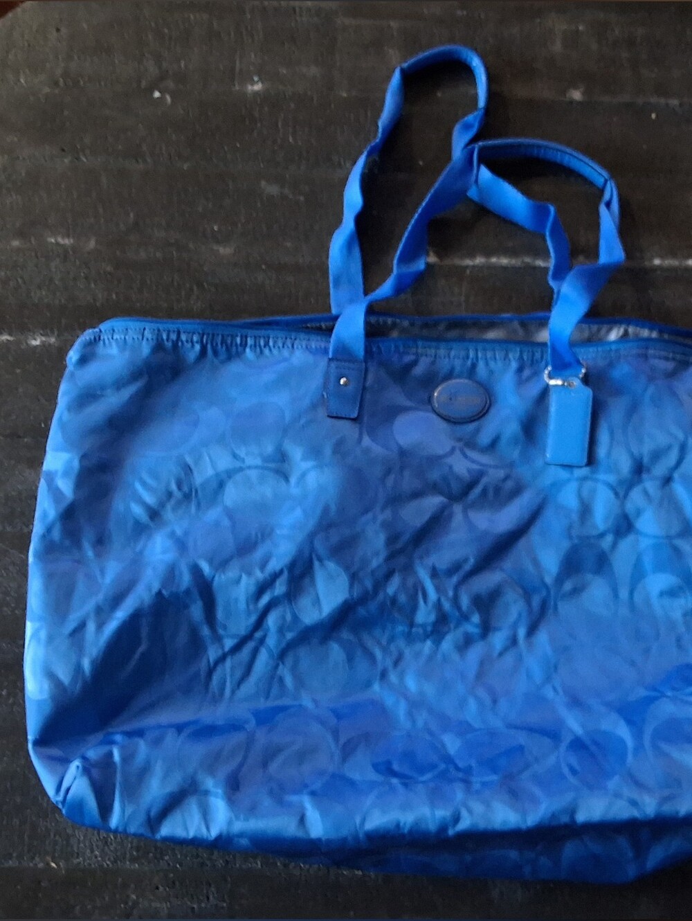 vibrant blue Coach Getaway Signature Nylon Packable Weekender Bag